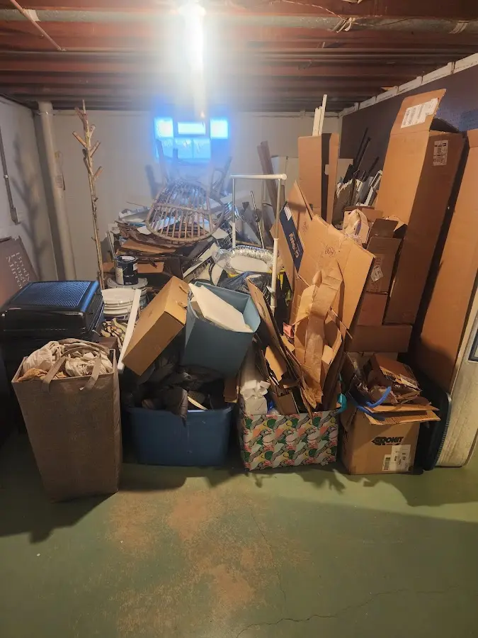 Roll-off dumpster container at job site for 2 Yard Dumpster Rental in Granby